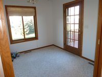 this is that four season porch, it leads to a deck on the back of the house. The house is on a double lot, so there is lots of land........ too much actually.