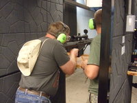 That's me with the Barret Rifle, the guide is getting ready to load that big cartridge.