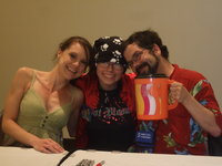 a con fan sandwitched by the lovely voice actress, Carli Mosier, and the always fun actor and director, Chris Ayers
