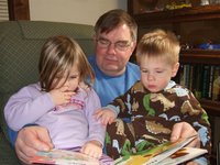 Leilani and Keoni, reading bedtime stories with grandpa, a month ago.