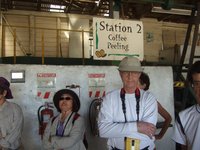 our group watched as she showed how the hard shell is pealed off the coffee bean by  the large machines.